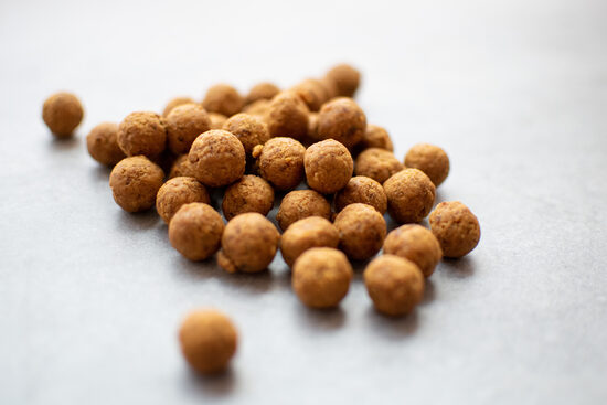 Natural fruit balls made from pineapple, mango and lime